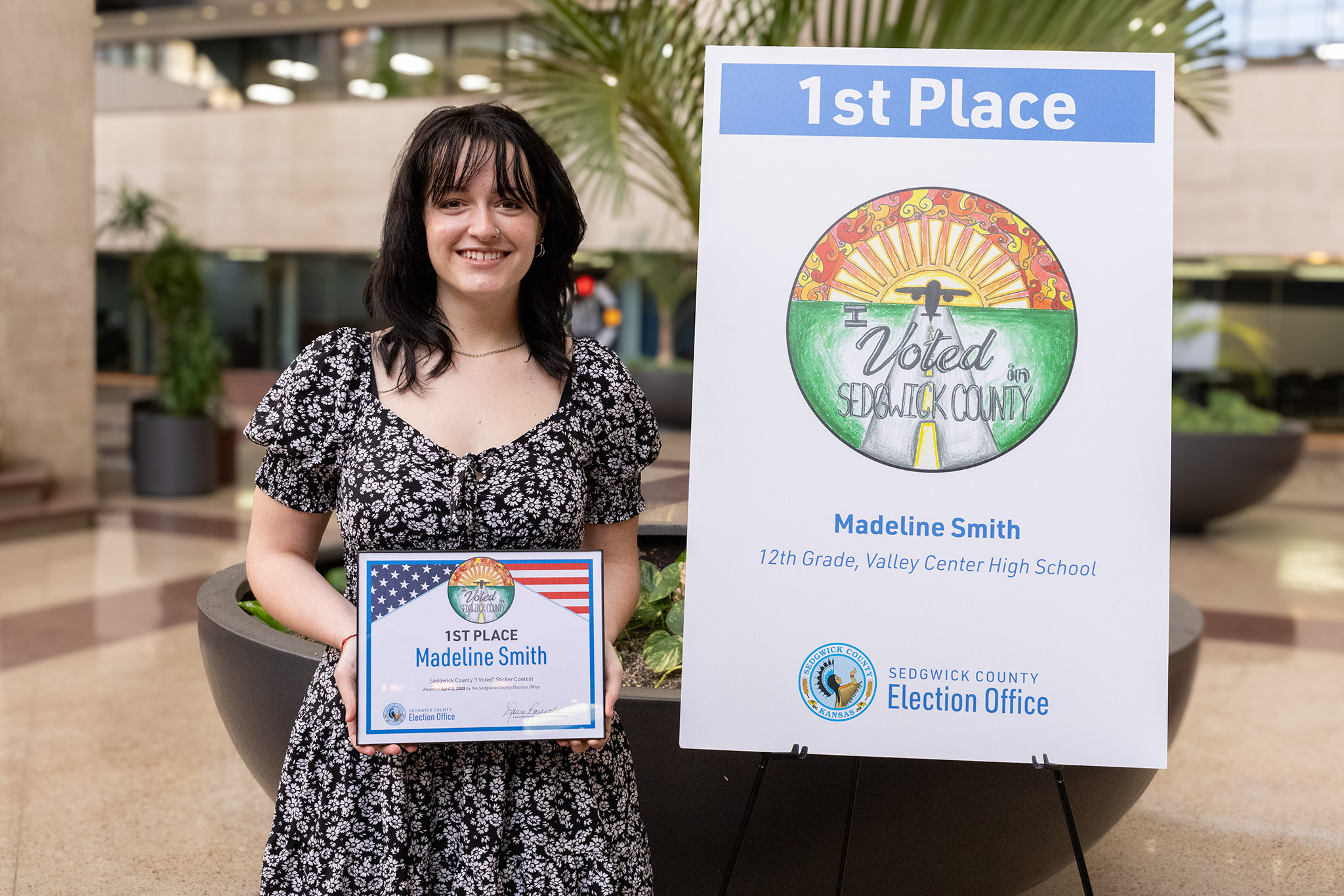 1st Place Winner holding Artwork